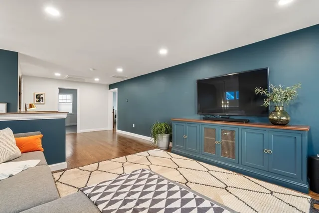 a kitchen with stainless steel appliances kitchen island granite countertop a sink and cabinets