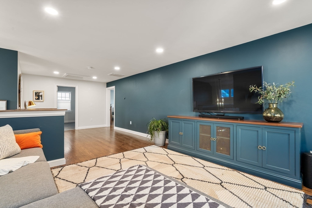 22 Sunset Way, Unit 22 Medfield, MA 02052 - Photo 28 of 42 a kitchen with stainless steel appliances kitchen island granite countertop a sink and cabinets