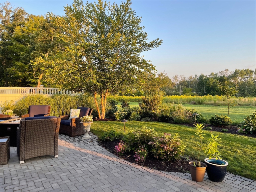 22 Sunset Way, Unit 22 Medfield, MA 02052 - Photo 36 of 42 a view of a garden with lawn chairs