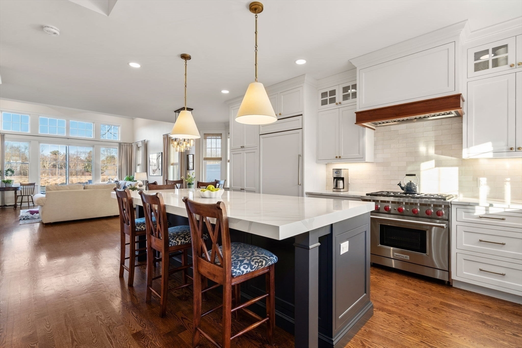 22 Sunset Way, Unit 22 Medfield, MA 02052 - Photo 8 of 42 a kitchen with a stove a refrigerator and wooden floor