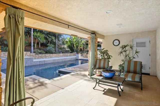 a bedroom with a bed rug and window