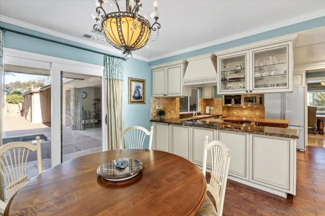 a view of a lush green hillside and a houses
