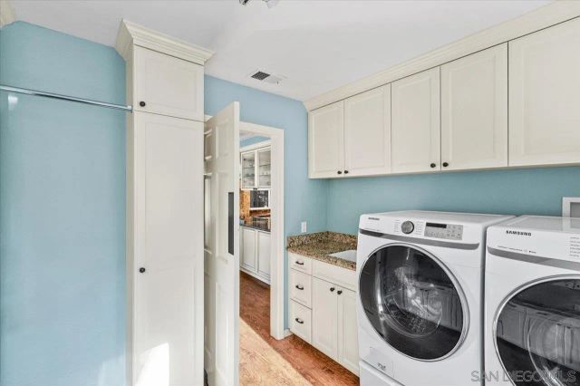 an aerial view of a house with a yard and garden