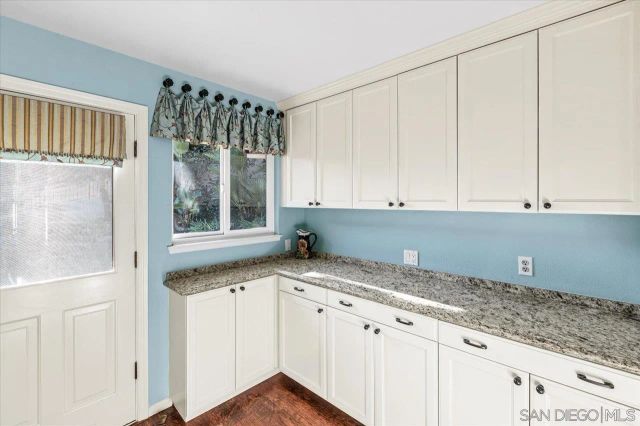 a view of a backyard with large trees