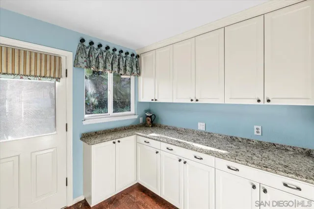 a view of a backyard with large trees