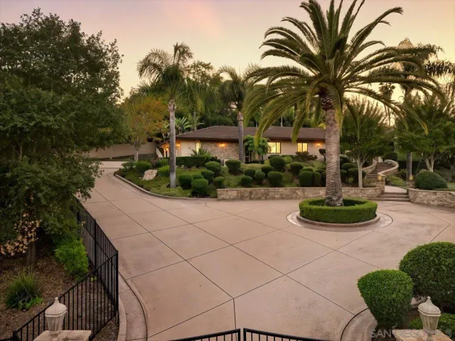 an aerial view of a house with a yard and garden