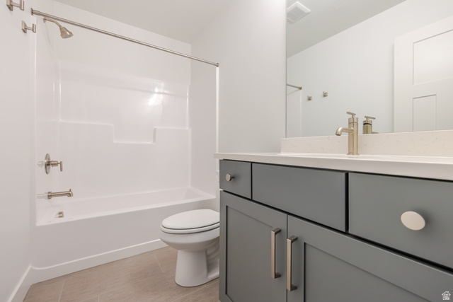 5228 South Acacia Drive, Unit 808 Mapleton, UT 84664 - Photo 19 of 22 Contemporary bathroom with a single vanity featuring a light countertop and gray cabinetry