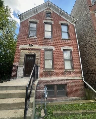 2829 West Polk Street, Unit 1 Chicago, IL 60612 - Photo 2 of 6 a front view of a house with glass windows