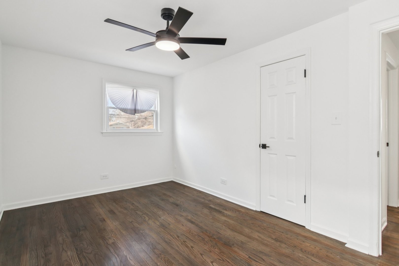8630 South Indiana Avenue Chicago, IL 60619 - Photo 17 of 33 a view of empty room with wooden floor