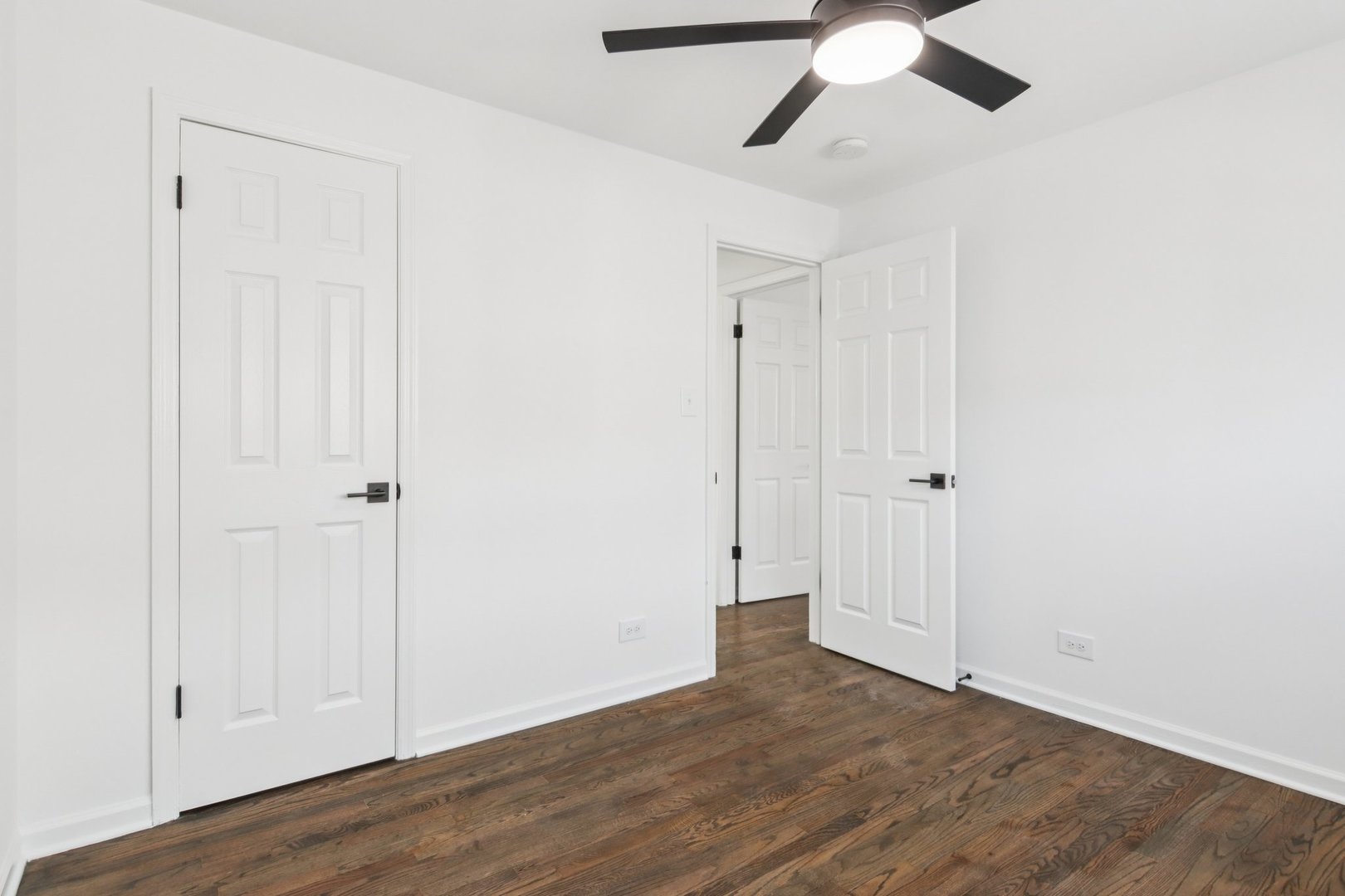 8630 South Indiana Avenue Chicago, IL 60619 - Photo 19 of 33 a view of empty room with wooden floor