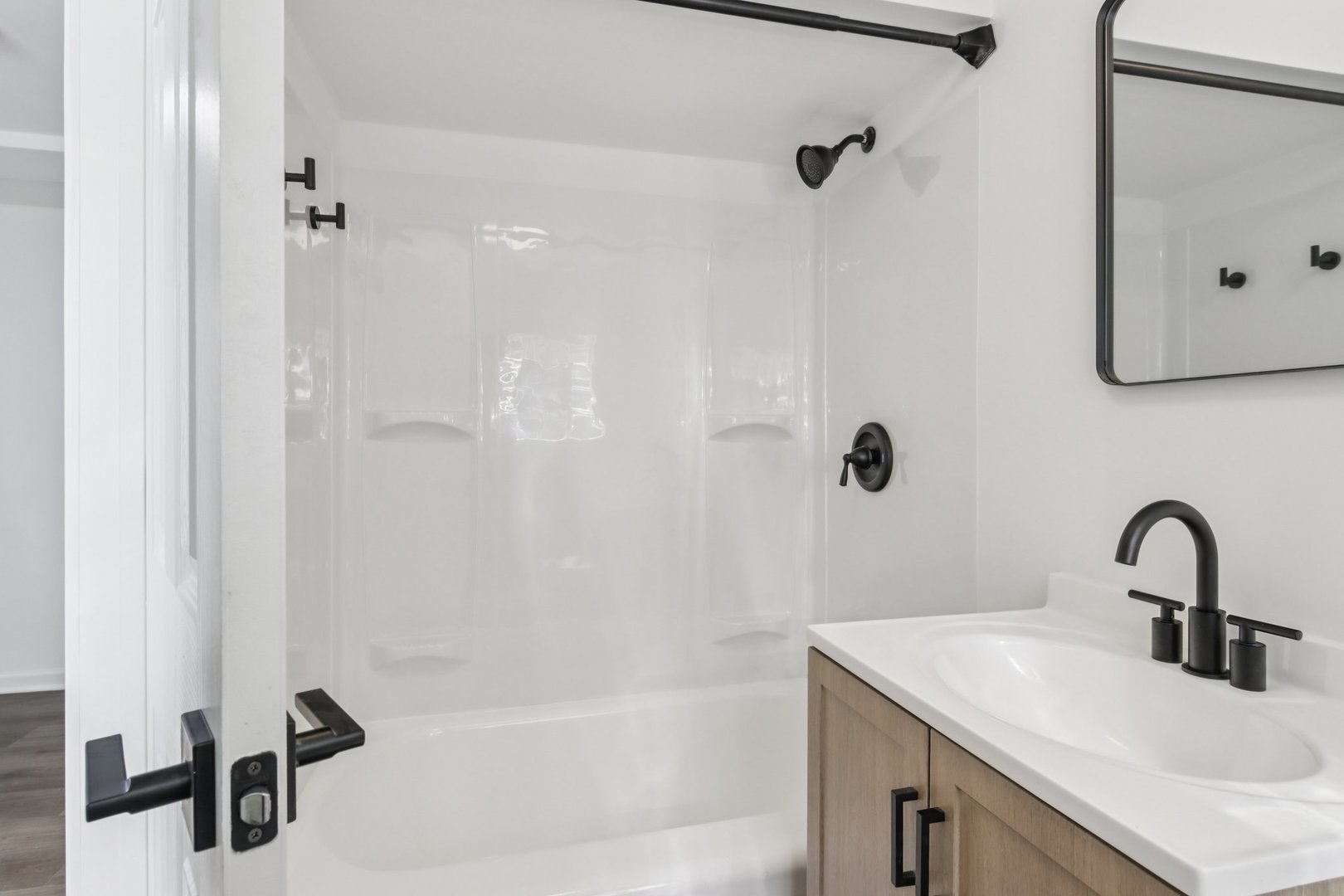 8630 South Indiana Avenue Chicago, IL 60619 - Photo 27 of 33 a bathroom with a sink and mirror