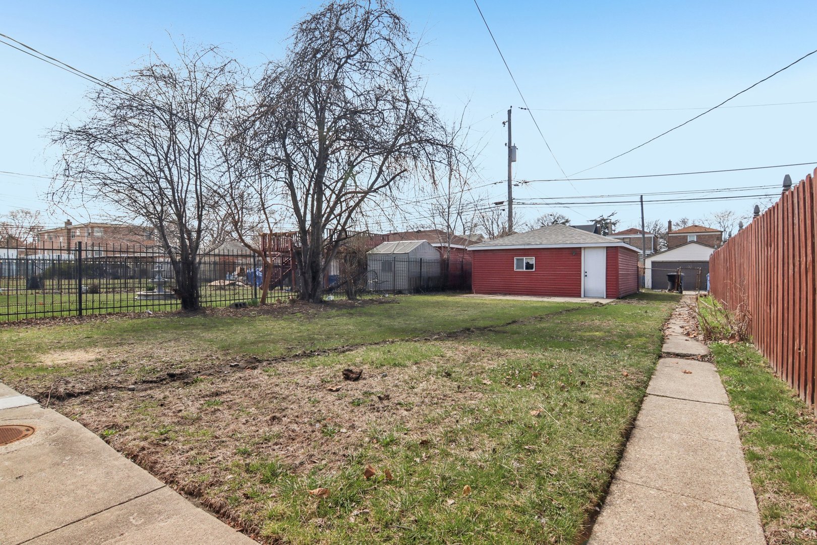 8630 South Indiana Avenue Chicago, IL 60619 - Photo 30 of 33 a front view of a house with a yard
