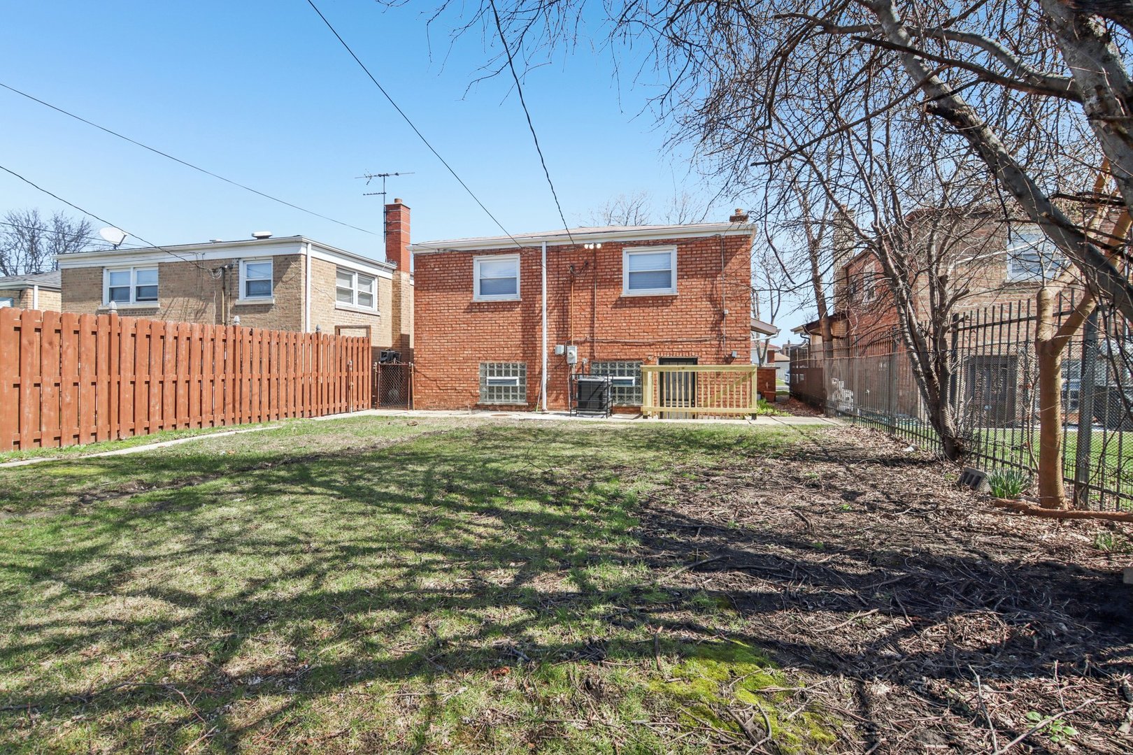 8630 South Indiana Avenue Chicago, IL 60619 - Photo 33 of 33 a front view of a house with a yard