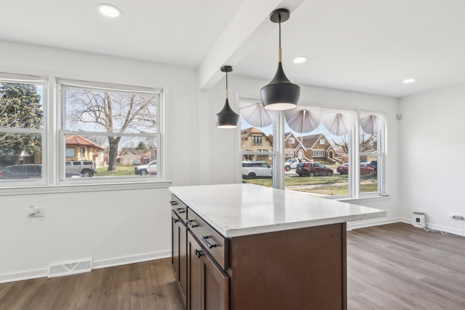 8630 South Indiana Avenue Chicago, IL 60619 - Photo 9 of 33 a view of open kitchen with wooden floor