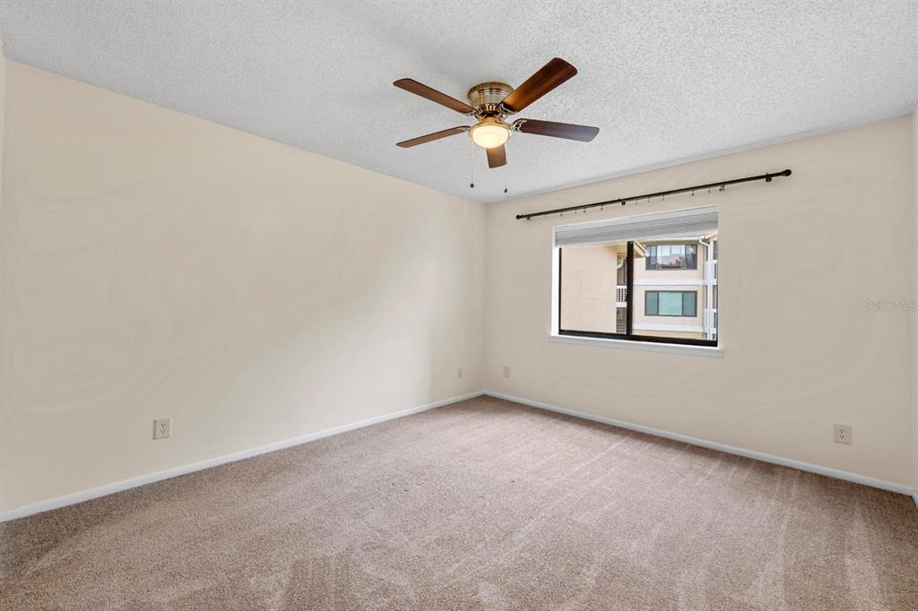 1550 South Belcher Road, Unit 223 Clearwater, FL 33764 - Photo 16 of 38 an empty room with a window and a fan