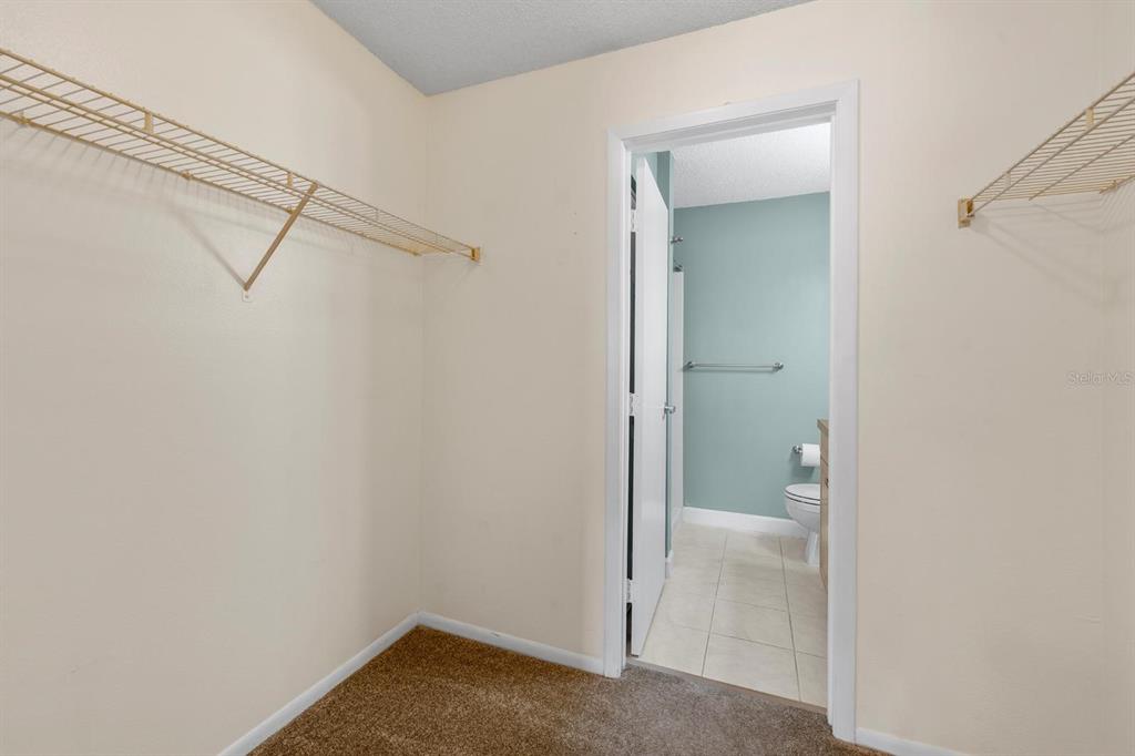 1550 South Belcher Road, Unit 223 Clearwater, FL 33764 - Photo 18 of 38 a bathroom that has a glass shower door