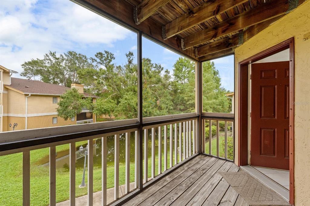 1550 South Belcher Road, Unit 223 Clearwater, FL 33764 - Photo 25 of 38 a view of a balcony with wooden floor