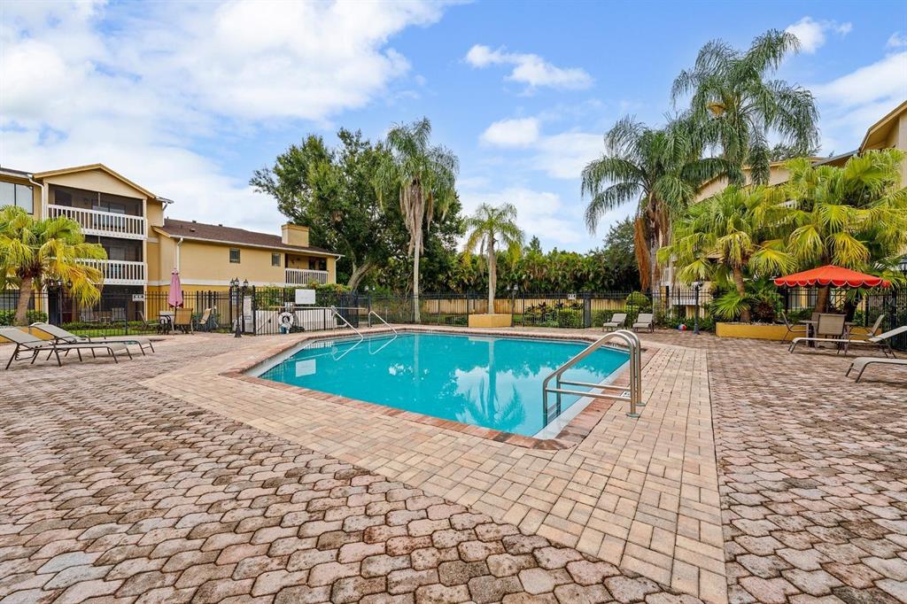 1550 South Belcher Road, Unit 223 Clearwater, FL 33764 - Photo 29 of 38 a view of outdoor space with swimming pool and lounge chair