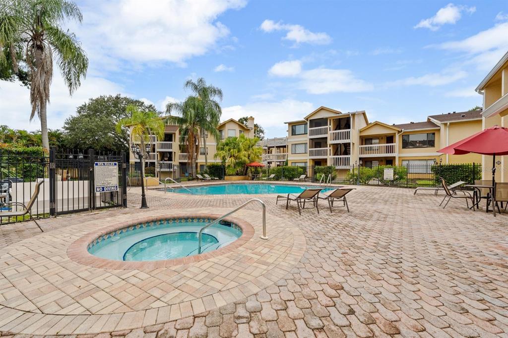 1550 South Belcher Road, Unit 223 Clearwater, FL 33764 - Photo 31 of 38 a view of a swimming pool with a patio