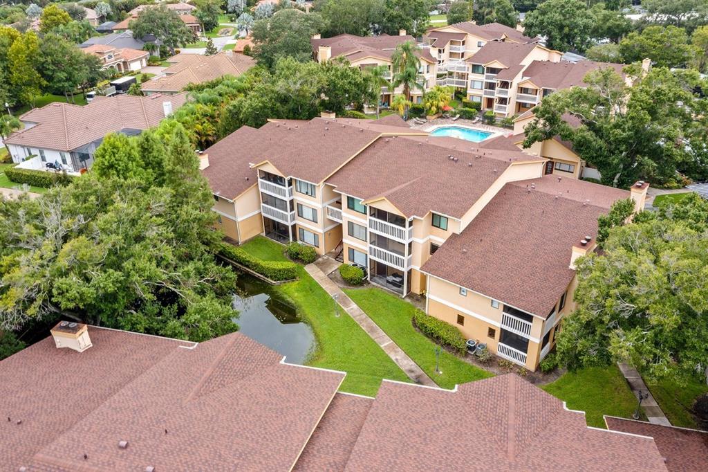 1550 South Belcher Road, Unit 223 Clearwater, FL 33764 - Photo 35 of 38 an aerial view of multiple houses with yard