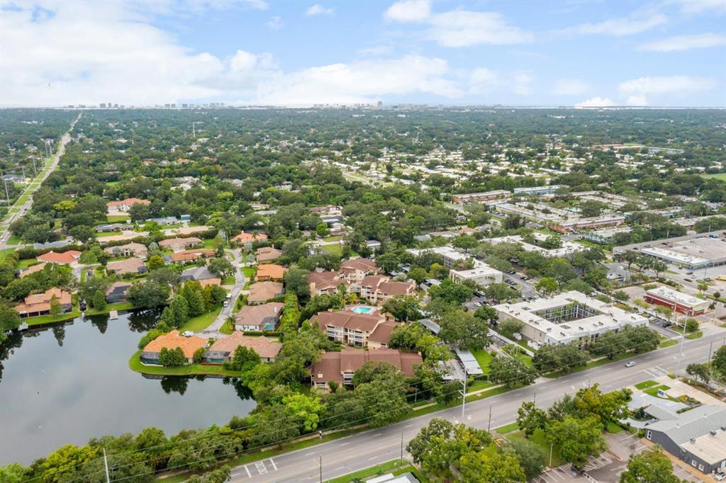 1550 South Belcher Road, Unit 223 Clearwater, FL 33764 - Photo 37 of 38 an aerial view of residential houses with outdoor space and trees