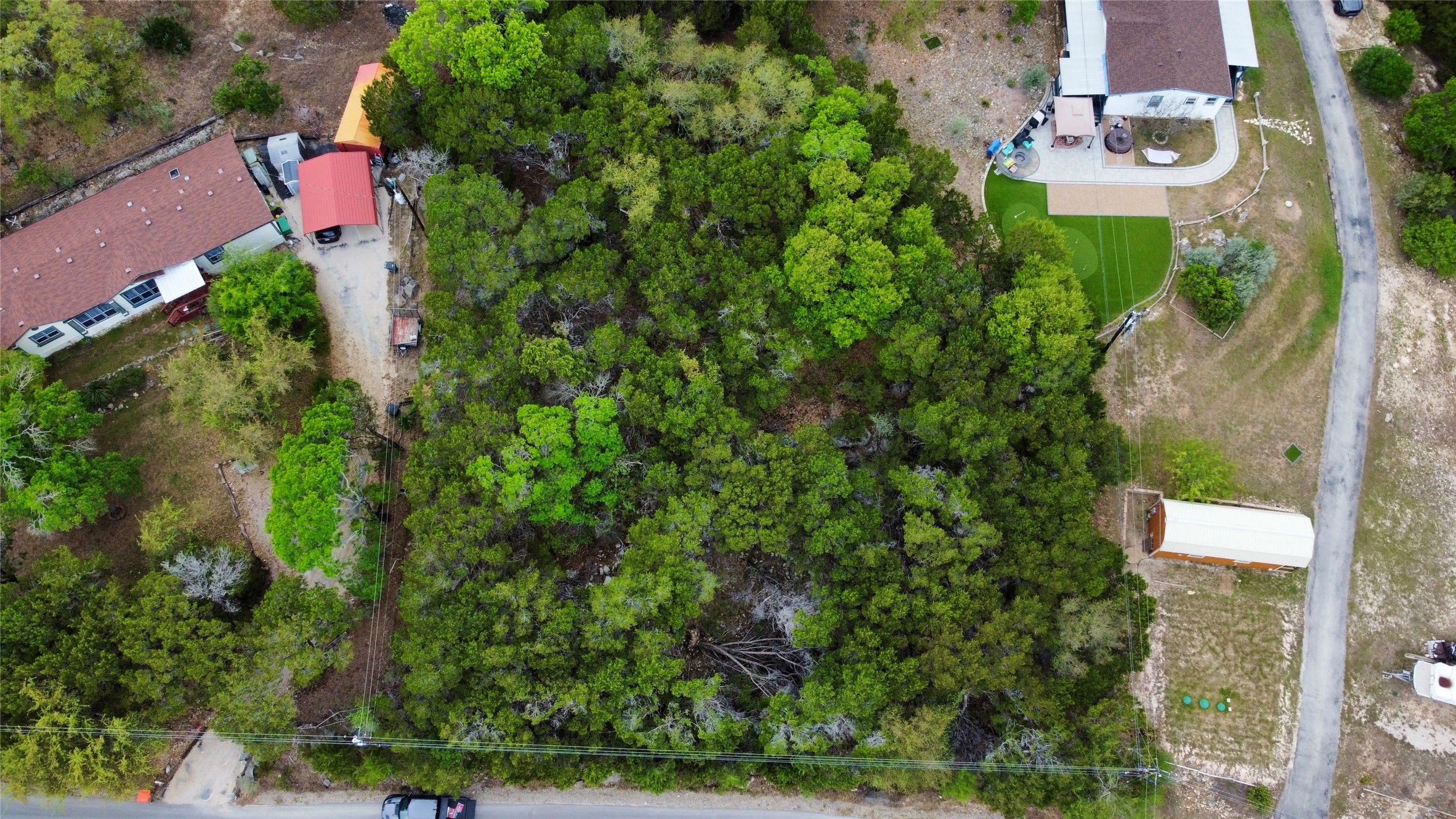 0 Rousey Street Canyon Lake, TX 78133 - Photo 6 of 7 an aerial view of residential house with outdoor space and trees all around