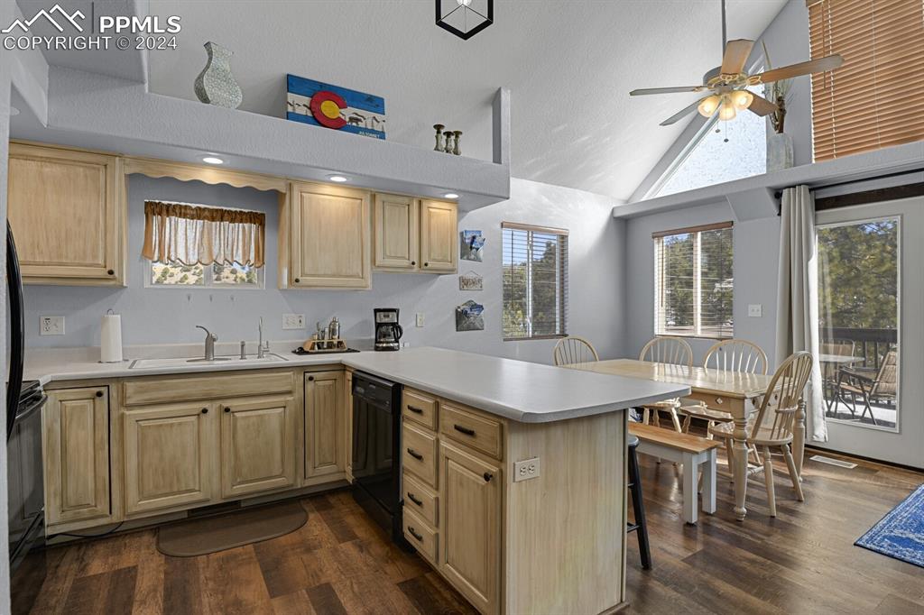 998 Bunker Hill Road Silver Cliff, CO 81252 - Photo 13 of 49 a kitchen with a sink cabinets and wooden floor
