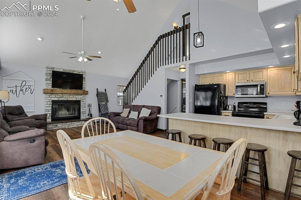 998 Bunker Hill Road Silver Cliff, CO 81252 - Photo 16 of 49 a living room with furniture a flat screen tv and a fireplace