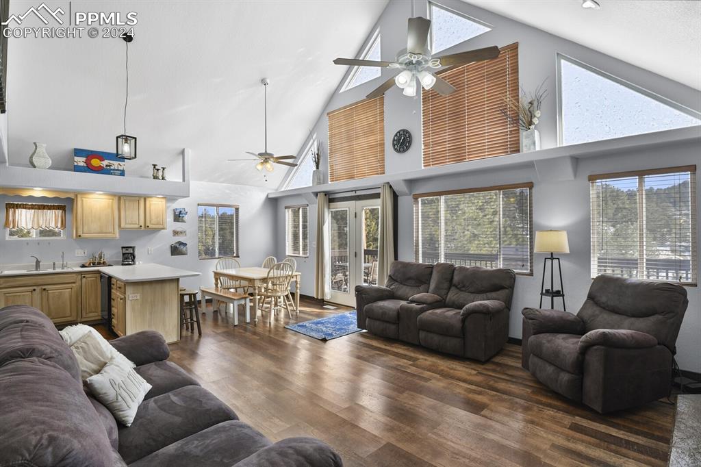 998 Bunker Hill Road Silver Cliff, CO 81252 - Photo 19 of 49 a living room with furniture and a large window