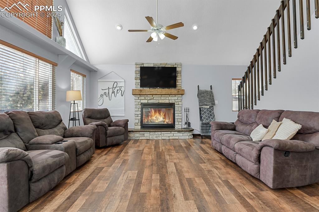 998 Bunker Hill Road Silver Cliff, CO 81252 - Photo 21 of 49 a living room with furniture a flat screen tv and a fireplace