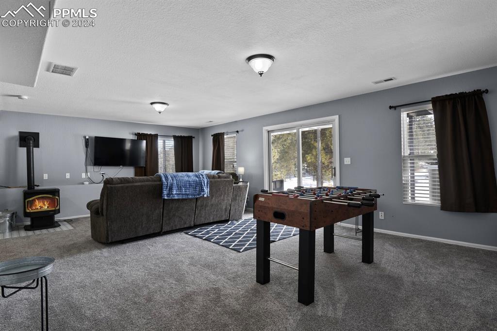 998 Bunker Hill Road Silver Cliff, CO 81252 - Photo 29 of 49 a living room with furniture and a window