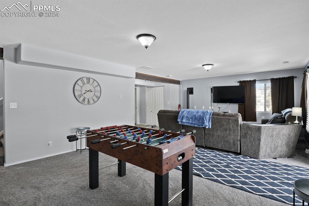 998 Bunker Hill Road Silver Cliff, CO 81252 - Photo 30 of 49 a living room with furniture and a flat screen tv