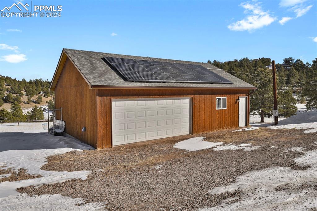 998 Bunker Hill Road Silver Cliff, CO 81252 - Photo 3 of 49 a front view of a house with a yard and garage