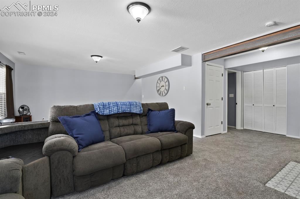 998 Bunker Hill Road Silver Cliff, CO 81252 - Photo 31 of 49 a living room with furniture