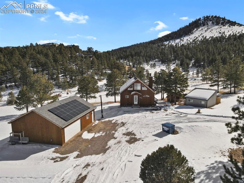 998 Bunker Hill Road Silver Cliff, CO 81252 - Photo 5 of 49 a view of a house with a snow in the background