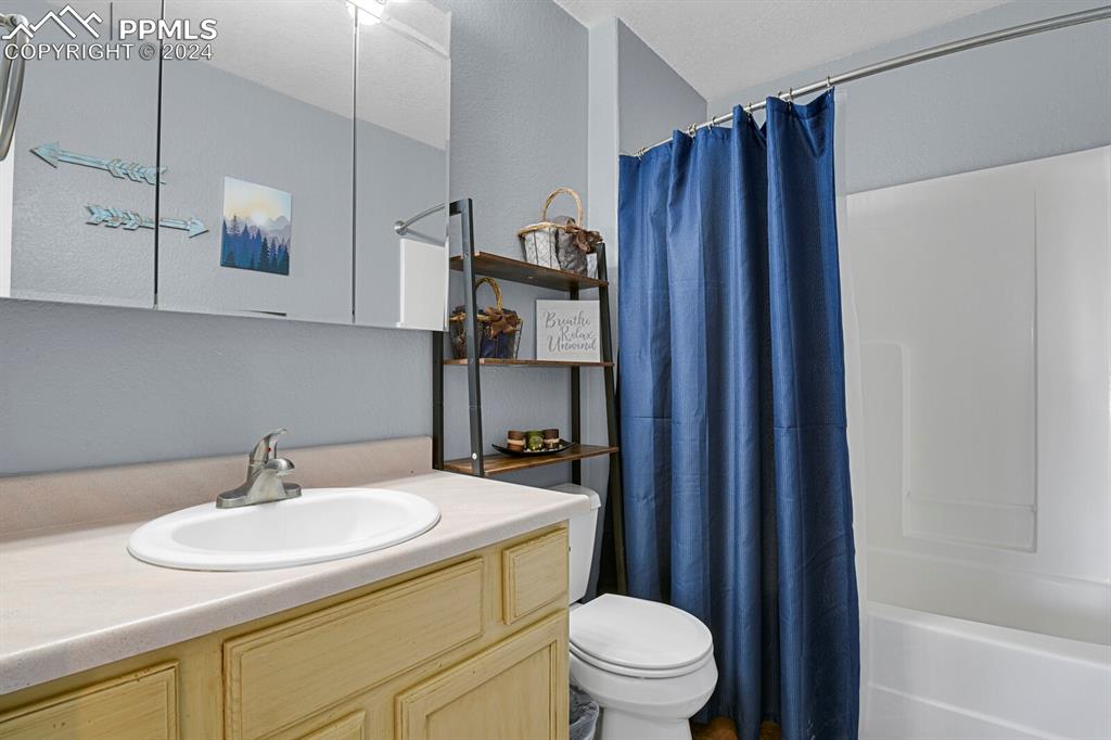 998 Bunker Hill Road Silver Cliff, CO 81252 - Photo 9 of 49 a bathroom with a sink a toilet and shower