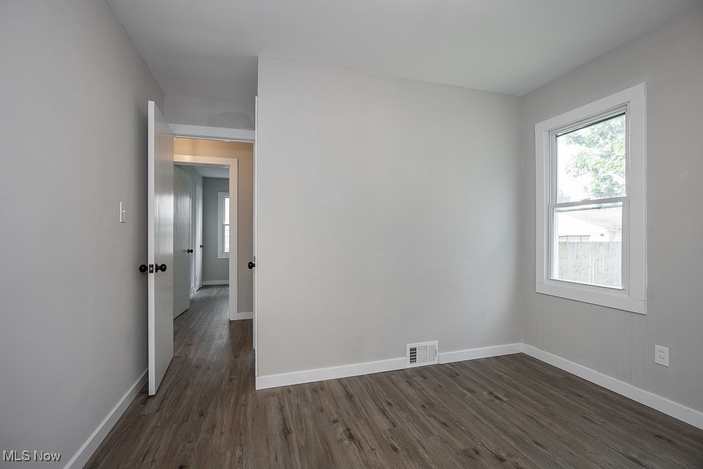 5607 Ridgewood Avenue Parma, OH 44129 - Photo 16 of 23 Empty room featuring dark hardwood / wood-style flooring