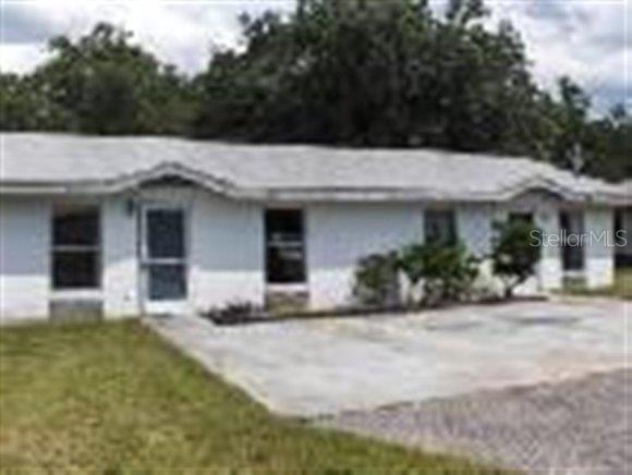 520 Independence Highway Inverness, FL 34453 - Photo 1 of 1 a front view of a house with a garden