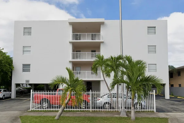 a view of a house with a iron fence