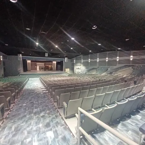 a living room with furniture a table and chairs