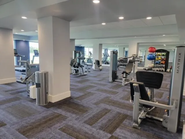 a room with lots of chairs and mirrors