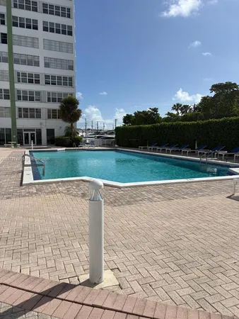a view of a swimming pool and a yard