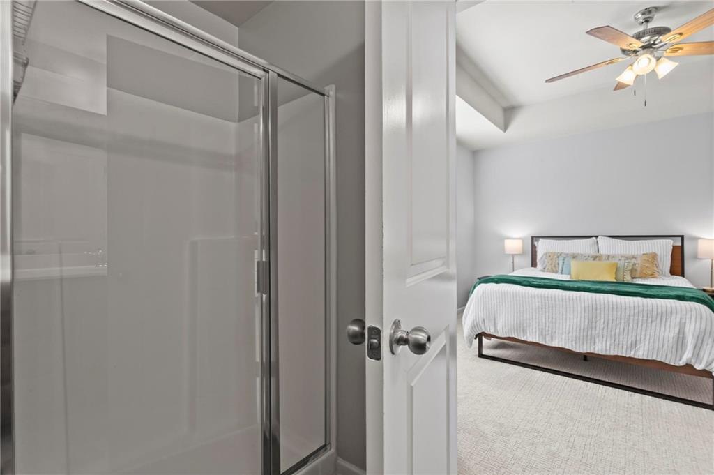 63 Creighton Lane Marietta, GA 30008 - Photo 16 of 23 a bedroom with a bed and a chandelier