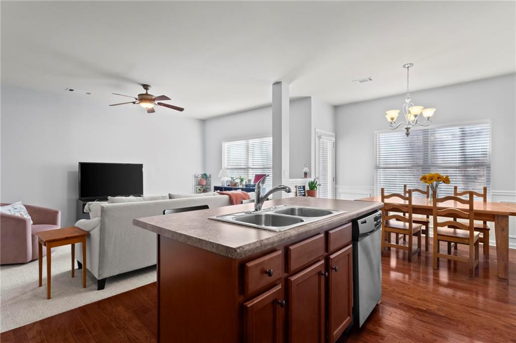 63 Creighton Lane Marietta, GA 30008 - Photo 10 of 23 a kitchen with a stove a counter top space and a dining table