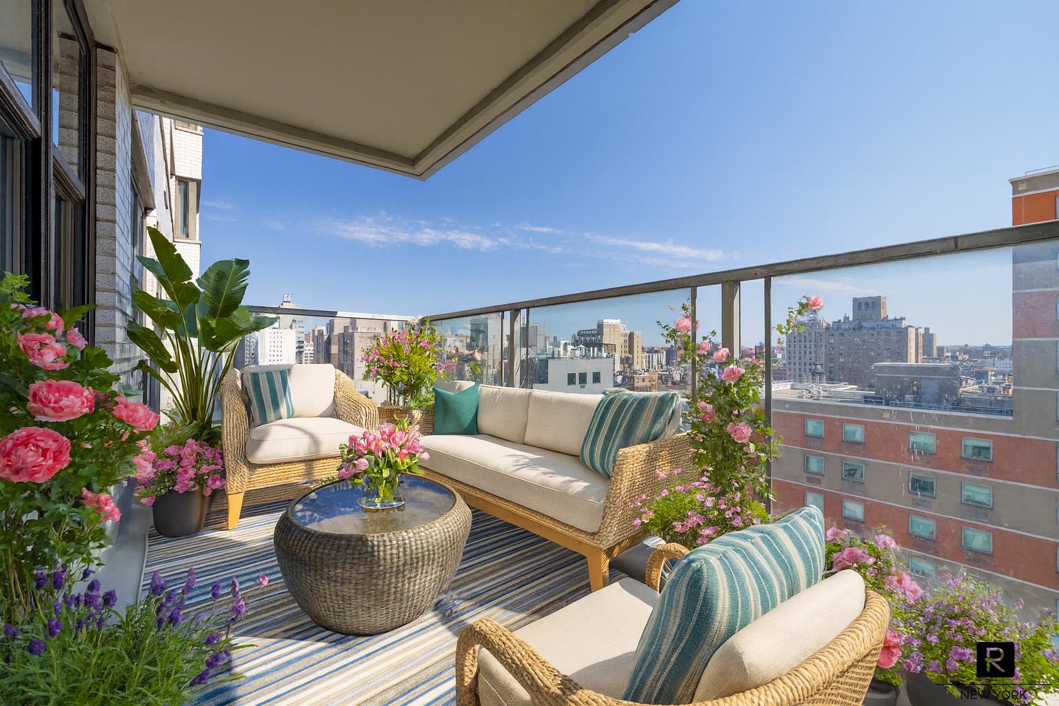 a living room with furniture and flowers