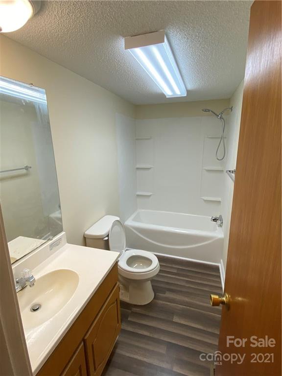 675 Hendricks Road Salisbury, NC 28147 - Photo 12 of 17 a bathroom with a sink a toilet and shower