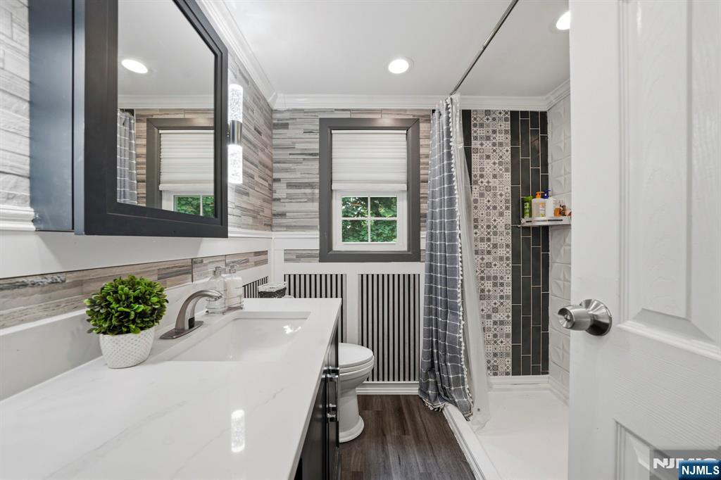 52 Barbara Drive Pompton Lakes, NJ 07442 - Photo 21 of 30 a bathroom with a sink a toilet and shower