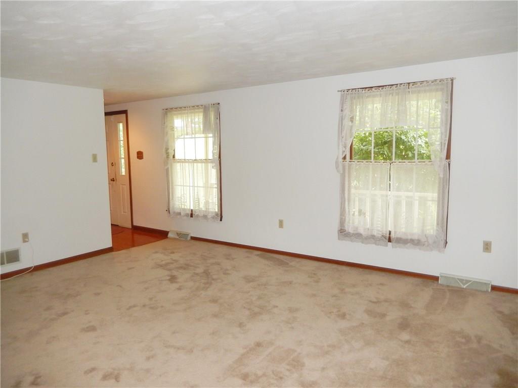 3231 Ridgeway Road Greensburg, PA 15601 - Photo 3 of 25 Enjoy family times in this large living room with neutral colors, freshly painted and great wall space.