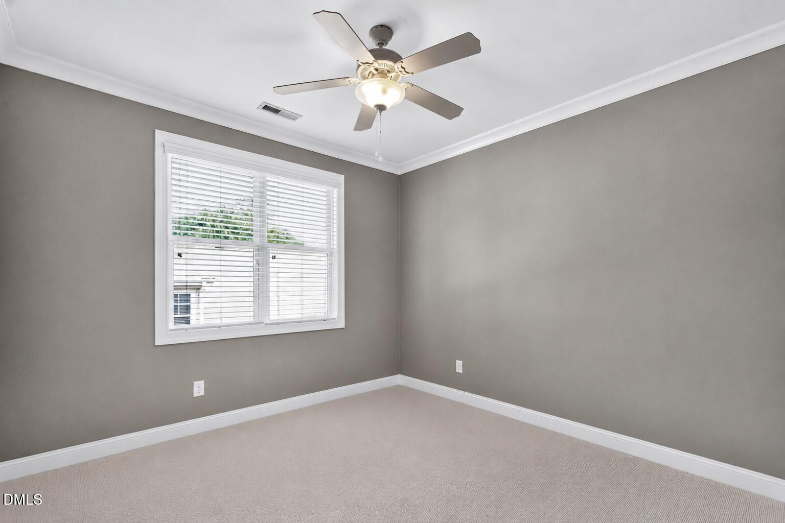 2745 Oberlin Road, Unit 103 Raleigh, NC 27608 - Photo 18 of 23 a view of an empty room with a window