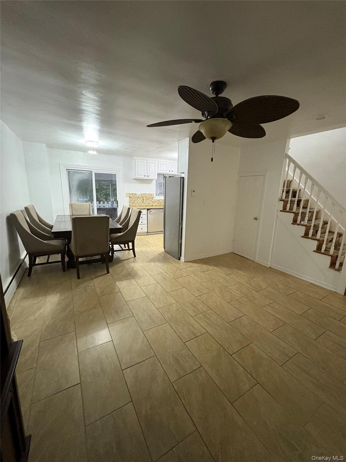 269 Balcom Avenue Bronx, NY 10465 - Photo 7 of 20 Dining space with stairs, ceiling fan, and a baseboard heating unit